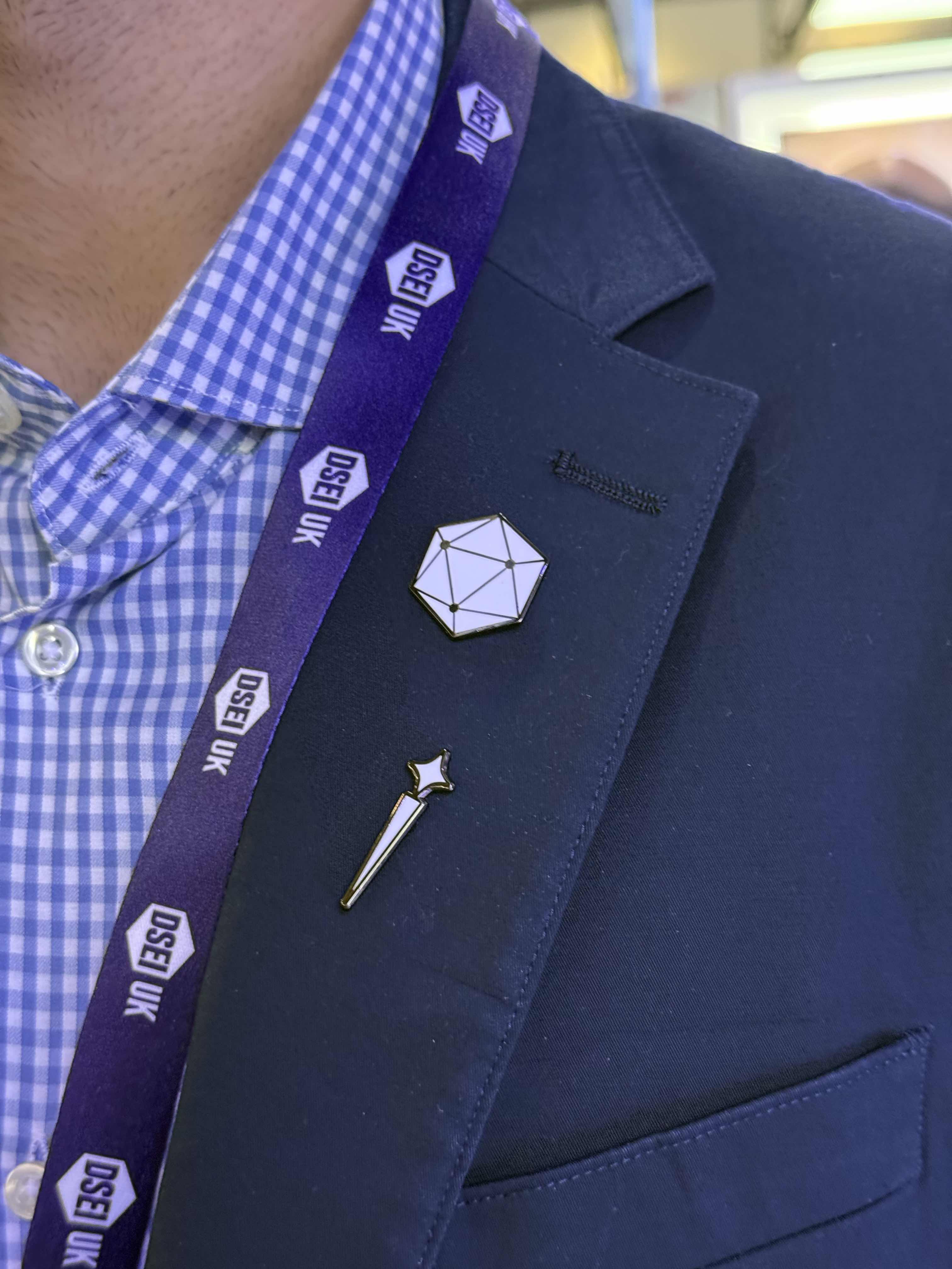 Sceptre and Hadean enamel pins on DSEI lanyard